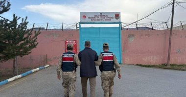A Gülenist Terror Group (FETÖ) member is escorted by security forces in Erzurum province, Türkiye, Nov. 11, 2025. (IHA Photo)