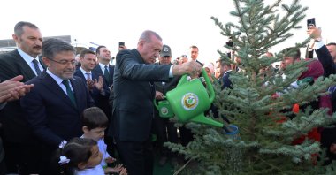 President Recep Tayyip Erdoğan waters a sapling during a tree-planting campaign on National Forestation Day, Ankara, Türkiye, Nov. 11, 2025. (AA Photo)