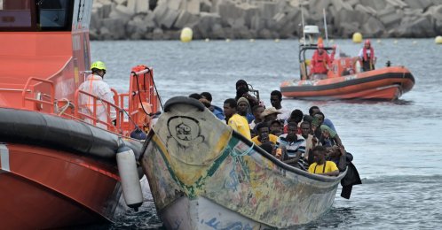 A boat carrying 72 sub-Saharan immigrants arrives at the port of La Restinga, El Hierro, Canary Islands, Spain, accompanied by maritime vessel Salvamar Navia, Oct. 24, 2025. (EPA File Photo)