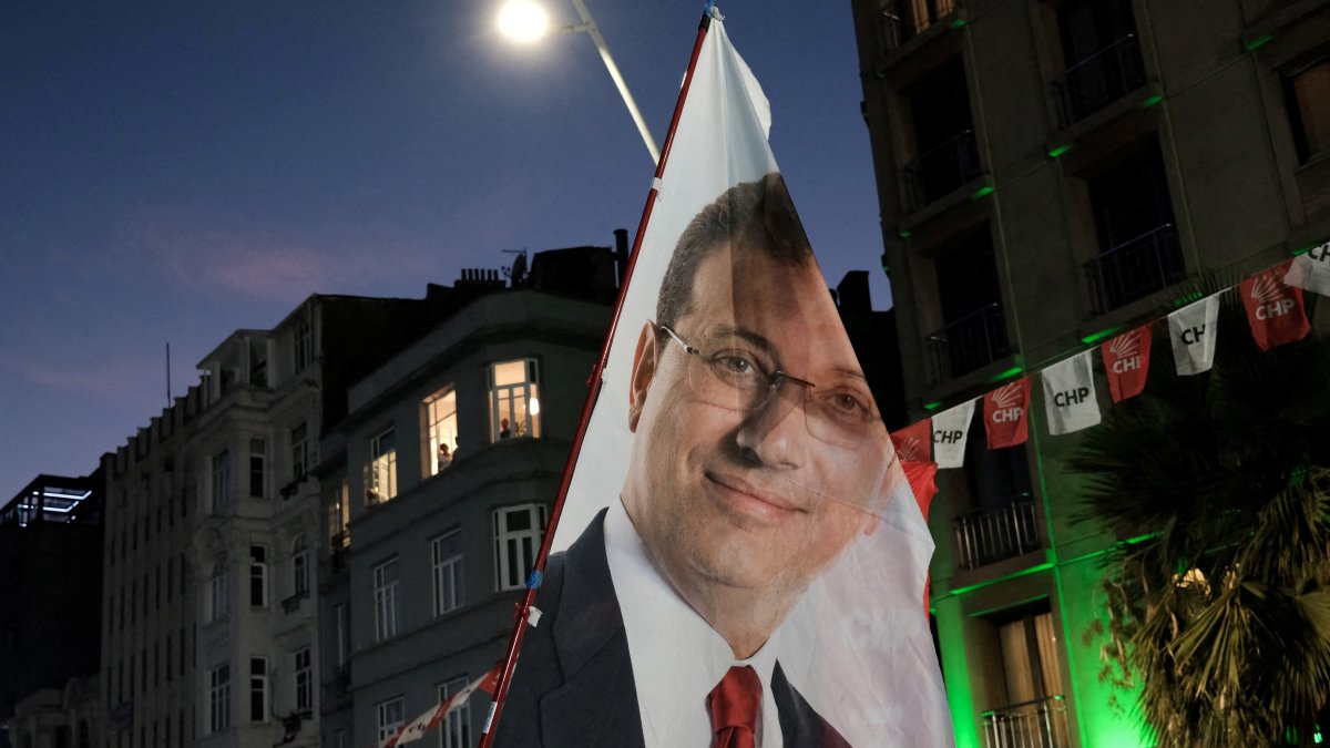 A flag with an image of the jailed Istanbul Mayor Ekrem Imamoğlu is displayed during a rally, Istanbul, Türkiye, Aug. 27, 2025. (Reuters Photo)