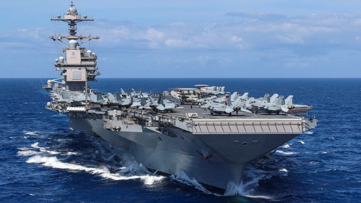 US deploys aircraft carrier group to raise Venezuela heat
