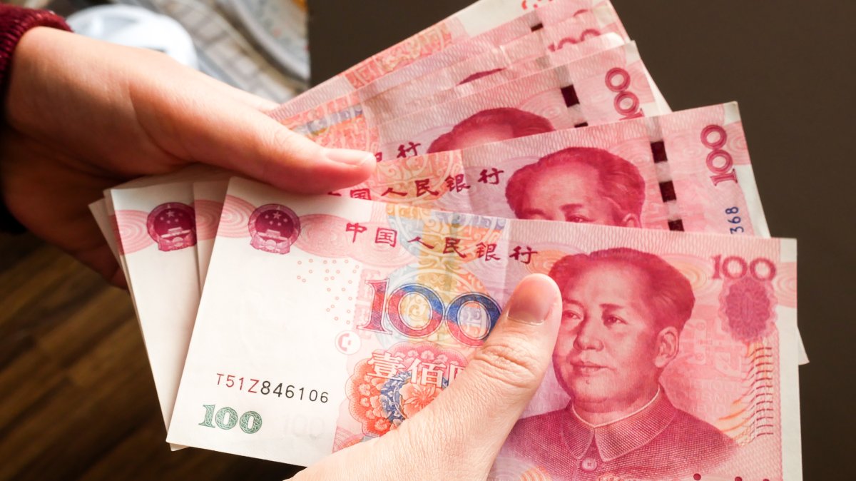 In this undated photo, a person counts some banknotes of the Chinese yuan. (Shutterstock Photo)