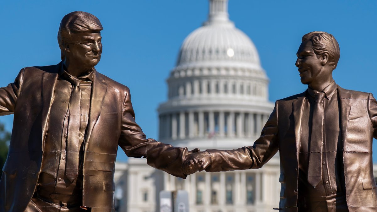 An art installation representing President Donald Trump and Jeffrey Epstein holding hands stands on the National Mall near the Capitol, in Washington D.C., U.S., Oct. 4, 2025. (AP Photo)