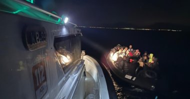 Irregular migrants are rescued by the Turkish coast guard off Izmir province, Türkiye, Nov. 12, 2025. (IHA Photo)