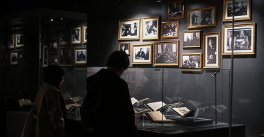 A visitor explores the &quot;Atatürk’s World of Books&quot; exhibition at the Presidential National Library, Ankara, Türkiye, Nov. 10, 2025. (AA Photo)