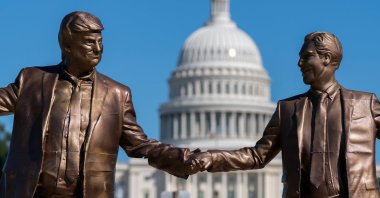 An art installation representing President Donald Trump and Jeffrey Epstein holding hands stands on the National Mall near the Capitol, in Washington D.C., U.S., Oct. 4, 2025. (AP Photo)