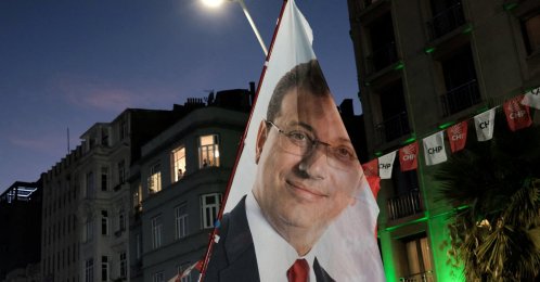 A flag with an image of the jailed Istanbul Mayor Ekrem Imamoğlu is displayed during a rally, Istanbul, Türkiye, Aug. 27, 2025. (Reuters Photo)