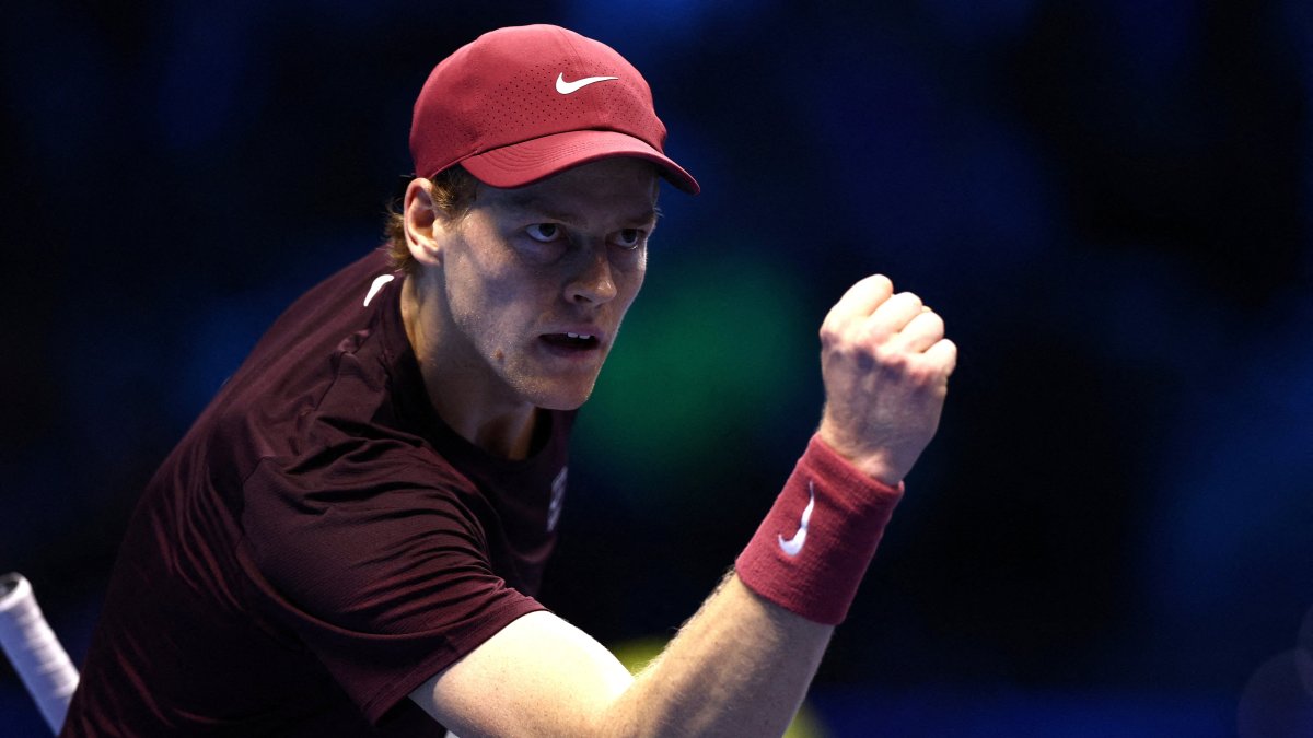 Italy's Jannik Sinner celebrates winning the first set during his ATP Finals group stage match against Germany's Alexander Zverev at the Palasport Olimpico, Turin, Italy, Nov. 12, 2025. (Reuters Photo)