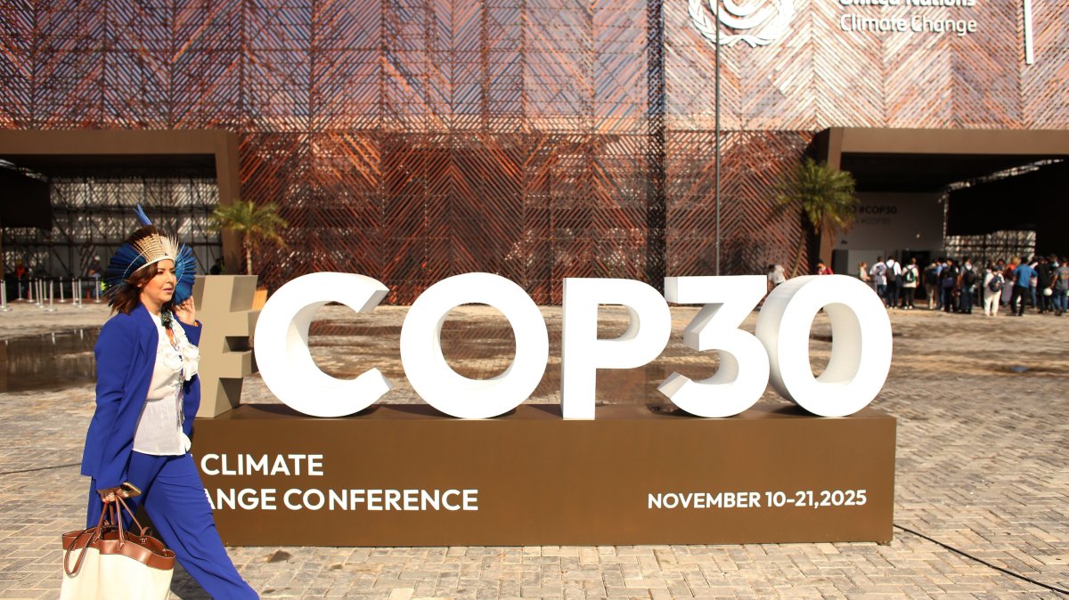 The COP30 logo is displayed prominently in front of the event building during the United Nations Climate Change Conference, Belem, Brazil, Nov. 7, 2025. (AA Photo)