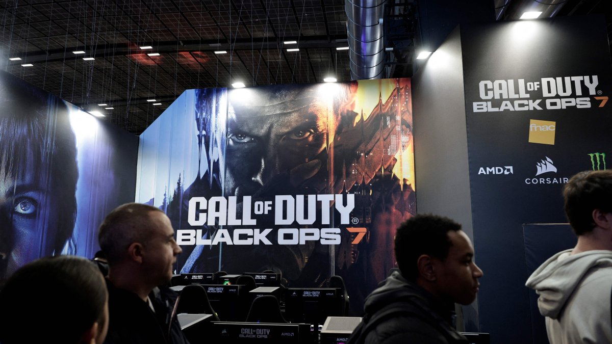 Visitors walk past a billboard promoting the soon-to-be-released Call of Duty: Black Ops 7 video game during the Paris Games Week fair, Paris, France, Oct. 30, 2025. (AFP Photo)