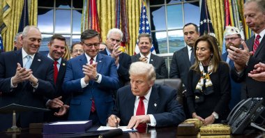 U.S. President Donald Trump (C) signs the funding package to re-open the federal government in the Oval Office of the White House in Washington, DC, U.S., Nov. 12, 2025. (EPA Photo)