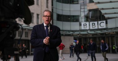 BBC correspondent David Sillito speaks on camera as he reports from outside the entrance to the BBC offices, London, U.K., Nov. 11, 2025. (AFP Photo)