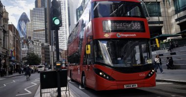 A double-decker bus drives in the City of London financial district of London, U.K., Oct. 21, 2025. (EPA Photo)