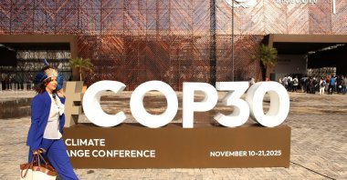 The COP30 logo is displayed prominently in front of the event building during the United Nations Climate Change Conference, Belem, Brazil, Nov. 7, 2025. (AA Photo)