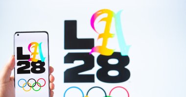 Mobile and monitor of the 2028 Los Angeles Olympic Games logo, Zhongshan, China, July 29, 2024. (Shutterstock Photo)
