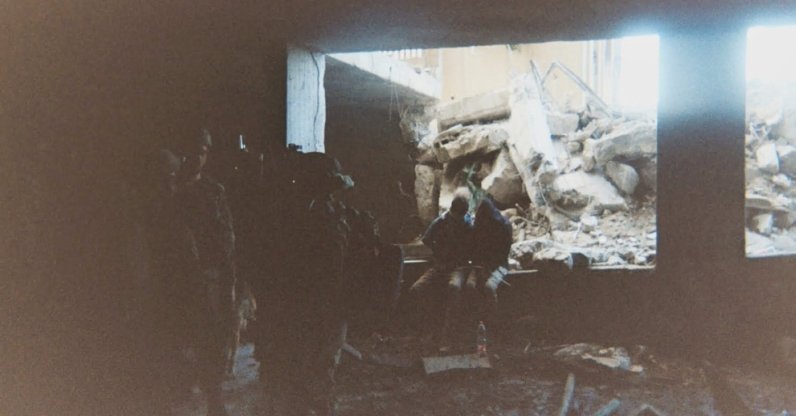 This photo, provided by Breaking the Silence, a whistleblower group of former Israeli soldiers, shows two detainees used as human shields being held inside a house in the Gaza City area in 2024. (AP Photo)