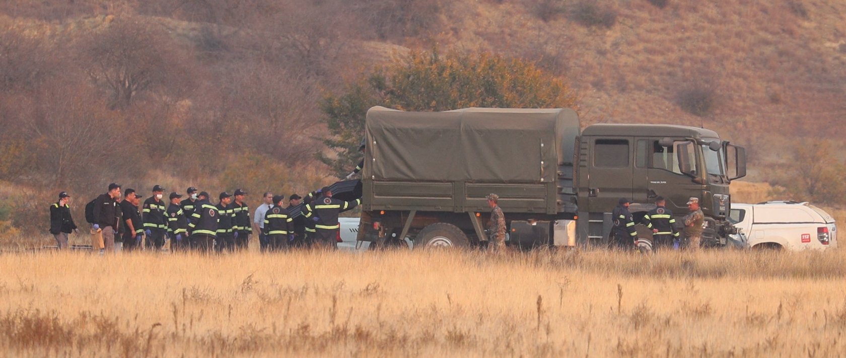 Members of emergency services work at the site of the Turkish C-130 military cargo plane crash near the Azerbaijani border, in Sighnaghi municipality, Georgia, Nov. 12, 2025. (Reuters Photo)