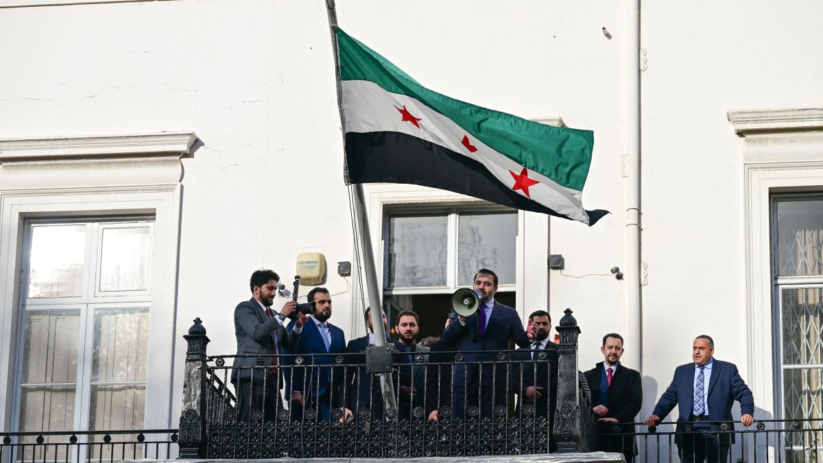 The Syrian flag flutters as Foreign Minister Assad Hassan Shaibani reopens his country's diplomatic mission, London, England, Nov. 13, 2025. (AA Photo)