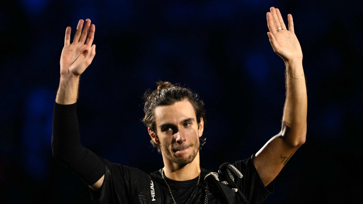 Italy's Lorenzo Musetti waves as he leaves the court after being defeated by Spain's Carlos Alcaraz at the ATP Finals tennis tournament, Turin, Italy, Nov. 13, 2025. (AFP Photo)