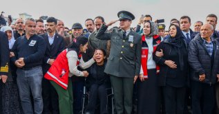 Relatives of three of the 20 Turkish army officers killed in a military cargo plane crash in Georgia, mourn a funeral ceremony, Ankara, Türkiye, Nov. 14, 2025. (EPA Photo)
