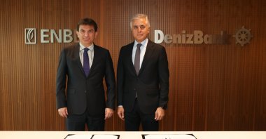 OYAK General Manager Murat Yalçıntaş (L) and DenizBank CEO Recep Baştuğ pose after a loan signing ceremony, Istanbul, Türkiye, Nov. 14, 2025. (AA Photo)