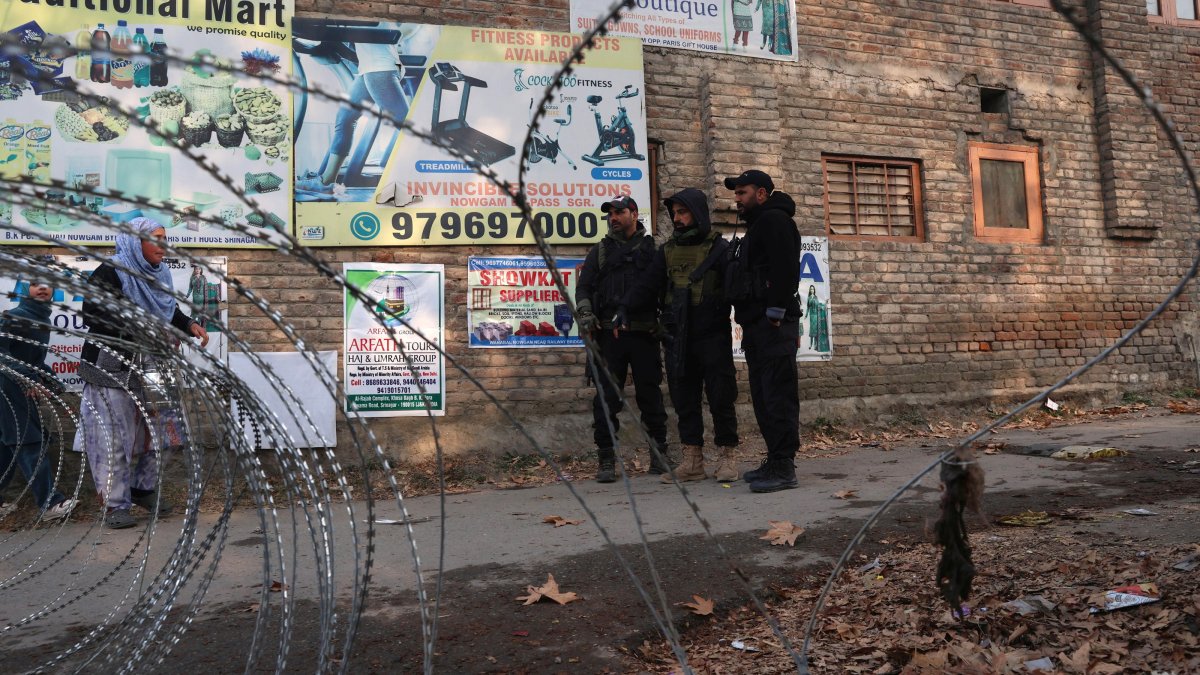 Indian policemen stand guard near the site of an accidental explosion on the outskirts of Srinagar, the summer capital of Indian Kashmir, Nov. 15, 2025. (EPA Photo)