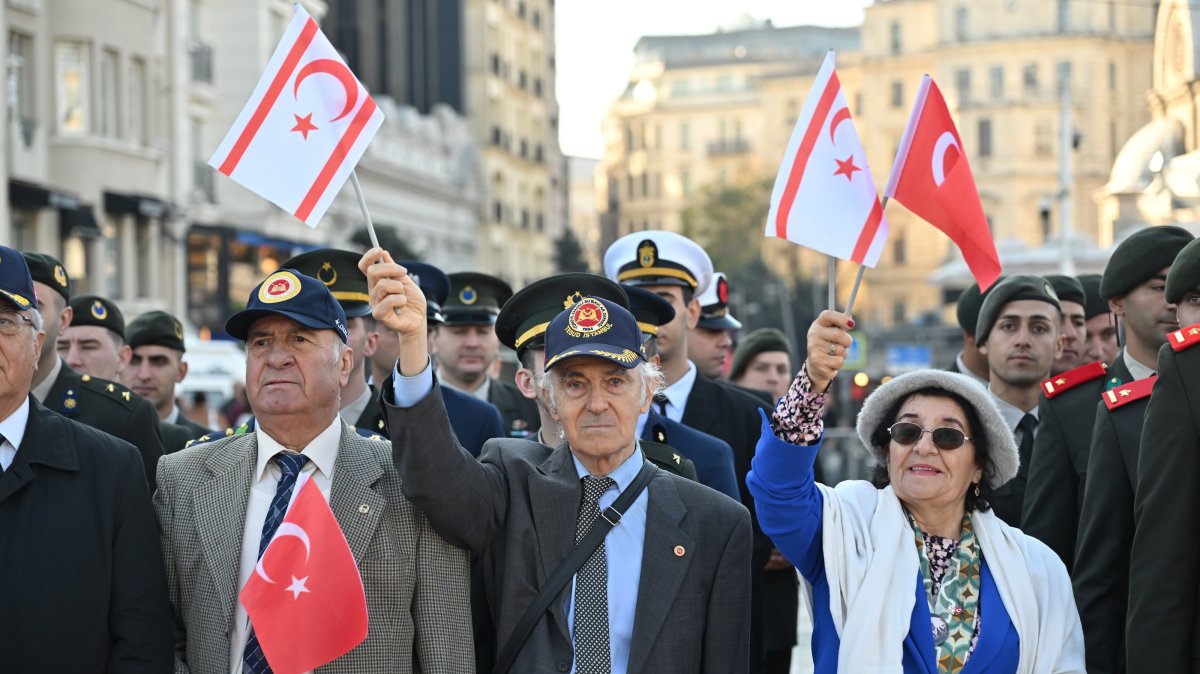 Veterans hold flags of Türkiye and the Turkish Republic of Northern Cyprus (TRNC) during a parade for TRNC's founding in Istanbul, Türkiye, Nov. 15, 2025. (AA Photo)