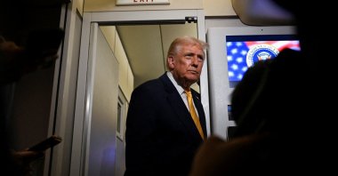U.S. President Donald Trump talks to members of the press on board Air Force One en route to Florida, U.S., Nov. 14, 2025. (Reuters Photo)