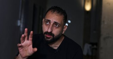A Palestinian man, who asked not to be named, one of 130 Palestinians granted entry to South Africa after initially being denied for not meeting immigration requirements, gestures during an interview with Reuters at an undisclosed location in Johannesburg, South Africa, Nov. 14, 2025. (Reuters Photo)