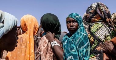 War-displaced Sudanese people wait at the registration area of the Oure Cassoni camp, Chad, Nov. 13, 2025. (AFP Photo)