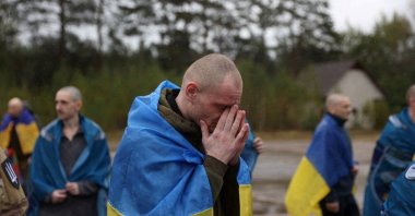 A Ukrainian prisoner of war reacts after a swap, at an unknown location in Ukraine, Oct. 2, 2025. (Reuters Photo)