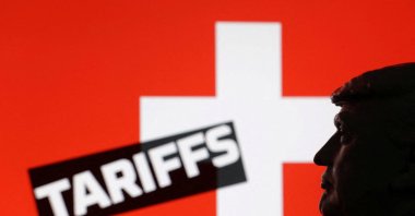 A 3D-printed miniature model of U.S. President Donald Trump, the Switzerland flag and the word &quot;Tariffs&quot; are seen in this illustration taken on July 23, 2025. (Reuters Photo)