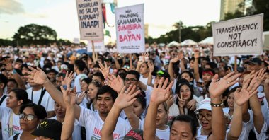 Members of the religious group Iglesia ni Cristo (Church of Christ) wave their hands during the first of a three-day anti-corruption protest at the Quirino Grandstand, Manila, Philippines, Nov. 16, 2025. (Reuters Photo)