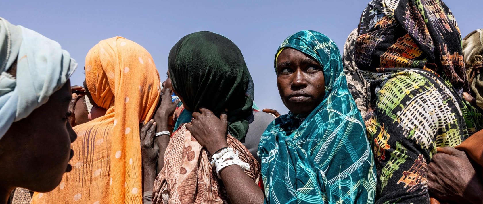 War-displaced Sudanese people wait at the registration area of the Oure Cassoni camp, Chad, Nov. 13, 2025. (AFP Photo)
