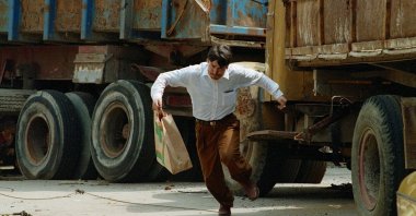 A Bosnian man dashes across a street where many civilians have been hit by sniper fire, Sarajevo, Bosnia-Herzegovina, Jan. 1, 1992. (Getty Images Photo)