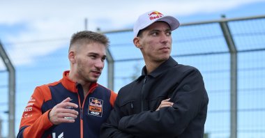 Moto2 rider Deniz Öncü (L) speaks with fellow Red Bull KTM Racing athlete Toprak Razgatlıoğlu ahead of the MotoGP World Championship’s final round, the Spanish Grand Prix, at the Ricardo Tormo Circuit, Valencia, Spain, Nov. 16, 2025. (AA Photo)