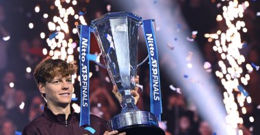 Italy&#039;s Jannik Sinner celebrates with the trophy after winning the men&#039;s singles final match against Spain&#039;s Carlos Alcaraz at the ATP Finals, Turin, Italy, Nov. 16, 2025. (EPA Photo)