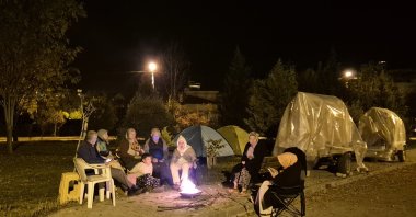 Residents gather outside their homes following the 4.9 magnitude earthquake in Sındırgı, Balıkesir, Türkiye, Oct. 11, 2025. (AA Photo)