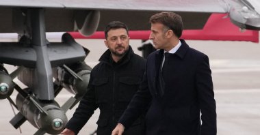 French President Emmanuel Macron and Ukrainian President Volodymyr Zelenskyy arrive to sign a letter of intent to buy up to 100 Rafale warplanes from France, at the Villacoublay air base near Paris, France, Nov. 17, 2025. (Reuters Photo)