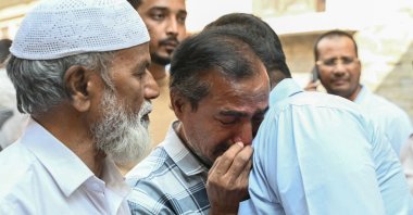 Family members and relatives of victims, who were killed in a bus accident near the holy city of Medina, mourn in Hyderabad, India, Nov. 17, 2025. (AFP Photo)