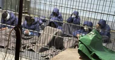 This 2024 photo provided by Breaking The Silence, a whistleblower group of former Israeli soldiers, shows prisoners with their hands and legs restrained in the yard at the Sde Teiman military prison in southern Israel. (AP Photo)