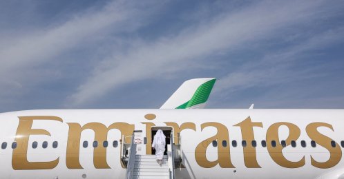 A man boards an Emirates plane displayed at the Dubai Airshow, in Dubai, United Arab Emirates, Nov. 17, 2025. (Reuters Photo)