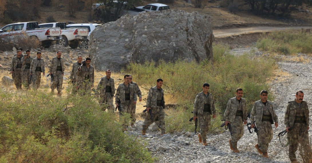 PKK terrorists walk for a disarmament ceremony in the Qandil mountains, Iraq, Oct. 26, 2025. (Reuters Photo)