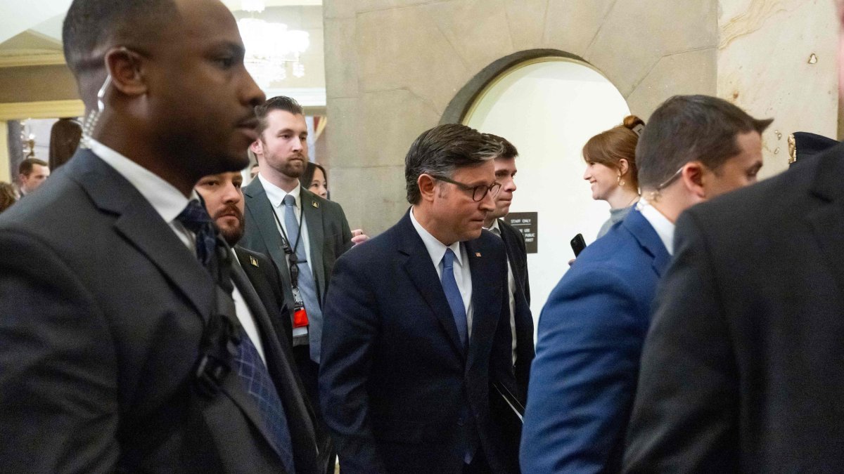 US Speaker of the House Mike Johnson (C), Republican of Louisiana, walks back to his office following a vote on the release of the Epstein files at the US Capitol in Washington, D.C., Nov. 18, 2025. (AFP Photo)