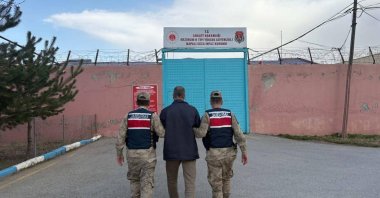 Gendarmerie officers escort a FETÖ convict to prison, Erzurum, eastern Türkiye, Nov. 7, 2025. (AA Photo)