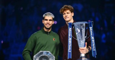 Italy&#039;s Jannik Sinner (R) and Spain&#039;s Carlos Alcaraz pose with their trophies at the end of the men&#039;s single final match at the ATP Finals tennis tournament, Turin, Italy, Nov. 16, 2025. (AFP Photo)