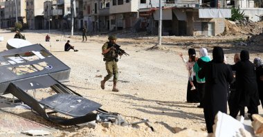Israeli soldiers stop displaced Palestinians from Nur Shams refugee camp attempting to return to their camp, near the West Bank city of Tulkarem, Nov. 18, 2025. (EPA Photo)