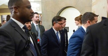 US Speaker of the House Mike Johnson (C), Republican of Louisiana, walks back to his office following a vote on the release of the Epstein files at the US Capitol in Washington, D.C., Nov. 18, 2025. (AFP Photo)