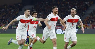 
Türkiye's Salih Özcan celebrates scoring their second goal with teammates with Barış Alper Yılmaz and Merih Demiral, at Estadio La Cartuja de Sevilla, in Seville, Spain, Nov. 18, 2025. (Reuters Photo)