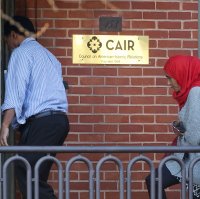 People enter the headquarters of Council on American-Islamic Relations (CAIR) in Washington, D.C., U.S., Dec. 10, 2015. (AP Photo)
